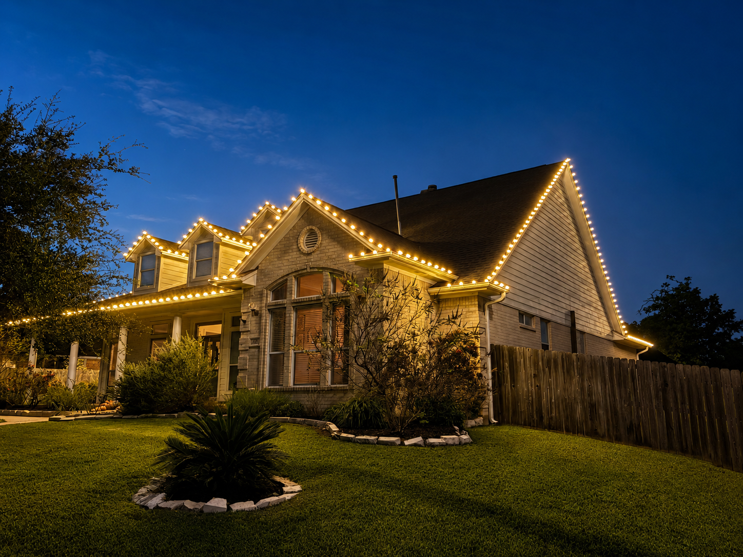 Ellison home with holiday lighting